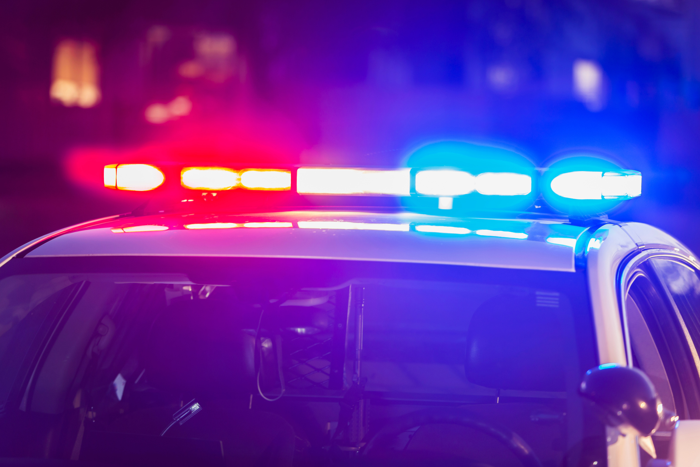 Flashing lights on top of police patrol car